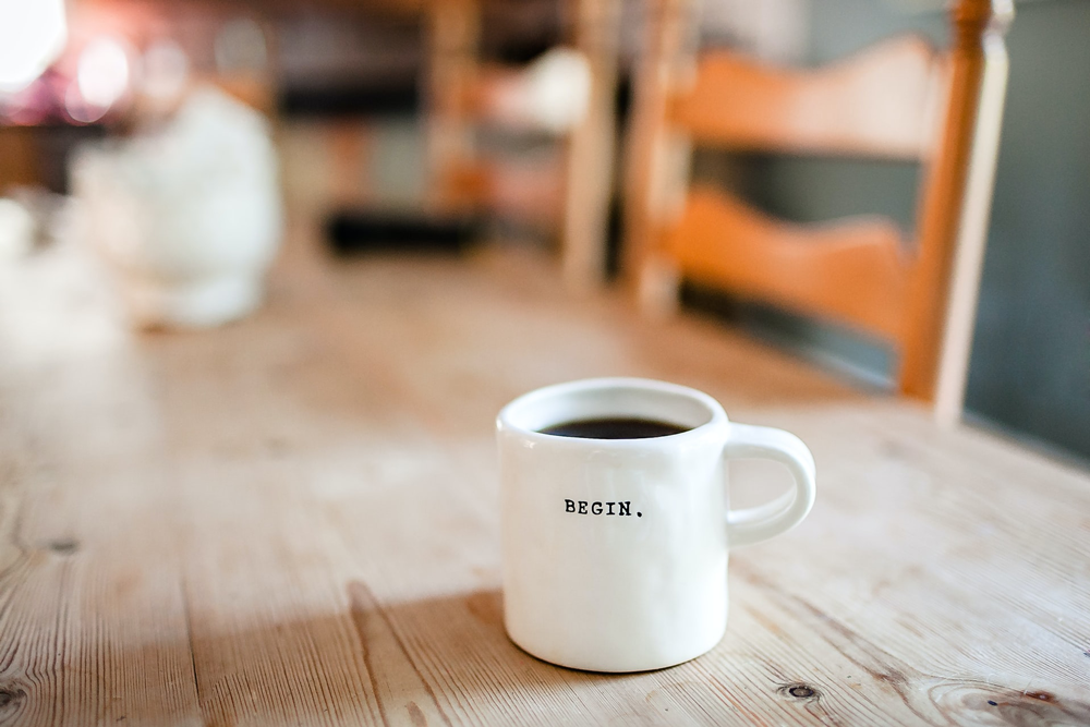 wordpress career: coffee mug that says begin
